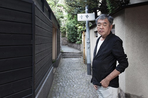 A profile shot of architect Kengo Kuma